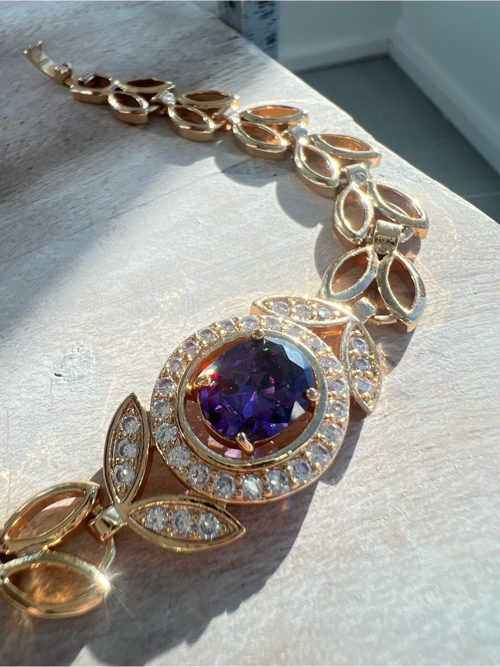 Gold Bracelet with Sparkly Purple Stone and Crystal Accents